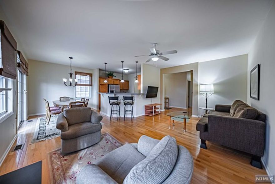 Beautifully maintained Ellington Townhouse End Unit w/2140 sq ft is located in the desired Cambridge Crossings Community,has been lovingly cared for by its original owner.This stunning home features a beautiful KIT with S/S APPL,abundant oak CAB, PAN CLOS, & BRKF bar.It seamlessly transitions into FDR, ideal for hosting gatherings.Sliding glass doors from the DR lead to large deck, overlooking Bromley Green's lush setting.Adjacent to DR is the generously sized LR, highlighted by cozy gas FPLC.Primary BR is bathed in natural light & features walk-in CLOS & en-suite BTH w/dual sinks, soaking tub, & stall SHWR.2nd BR boasts a huge walk-in CLOS & is accompanied by nearby hall BTH.Main FLR is adorned w/9 ft CEIL & mostly HDWD FLRS enhancing the home's elegance.On lower level,you'll find Family Rm,Office w/glass sliders to patio, Powder RM & LNDRY RM. 1 car GAR.Updates-C/A ('22),HWH ('23) Dishwasher('24) & 3 year warranty for added peace of mind.SELLER PAID SPECIAL ASSESSMENTS IN FULL