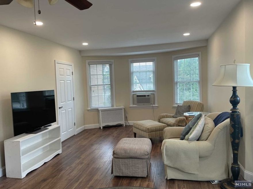 Experience the charm of this sun-soaked, 2-bedroom, 1-bathroom apartment featuring an inviting open floor plan, nestled on the second floor of a delightful 2-family home. Enjoy the convenience of both a private rear entrance and a welcoming front entrance. You'll have the luxury of two designated parking spots in the driveway, with additional street parking readily available. Inside, you'll find brand-new in-unit washer and dryer, fresh carpeting in both bedrooms, and the bonus of a spacious walk-in storage closet. Stay comfortable year-round with included window air conditioning units. This superb location places you within easy reach of all major highways, just a short stroll away from charming local parks, and the vibrant dining and shopping options on Main Street. Plus, you're within walking distance of both the NYC bus and train stations, making your commute a breeze. As an added perk, water is included in the rent, ensuring a hassle-free living experience.