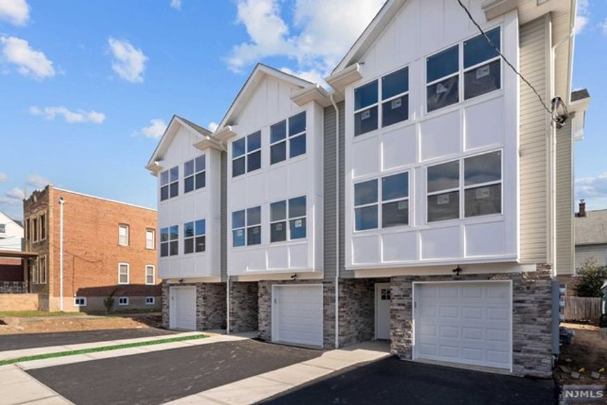 Remarkable brand new construction triplex home (3 separate deeds) located within a close proximity to mass transit! Great townhouse alternative with $0 monthly maintenance fee! Step inside to a stunning living room and dining room featuring open space layout. Gourmet kitchen with an island followed by a sliding door to rear deck and yard as well as powder room to complete first floor. The second floor features a spacious master bedroom w/master bathroom. Additional 2 bedrooms, full bath and laundry room on the same level. Bonus finished ground level room great for entertaining and/or office and powder room on the ground level! Attached garage and driveway. Exceptional exterior finishes with stone and stucco. Extraordinary quality of craftsmanship! Excellent for commuters - located less than a mile to Plauderville Train Station!