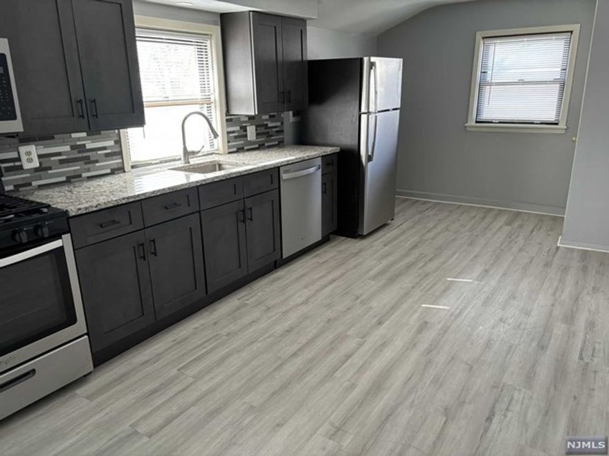 Recently updated apartment with granite counter top. Hardwood floors, Washer/dryer hook-up, one off-street parking space provided. Close to NY bus. No pets