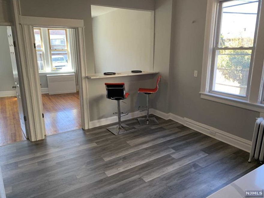 Fully Renovated Open Concept 1st floor 1 bedroom with hardwood floors in living room and bedroom, storage closet and parking in lot! Available immediately or April 1st.
