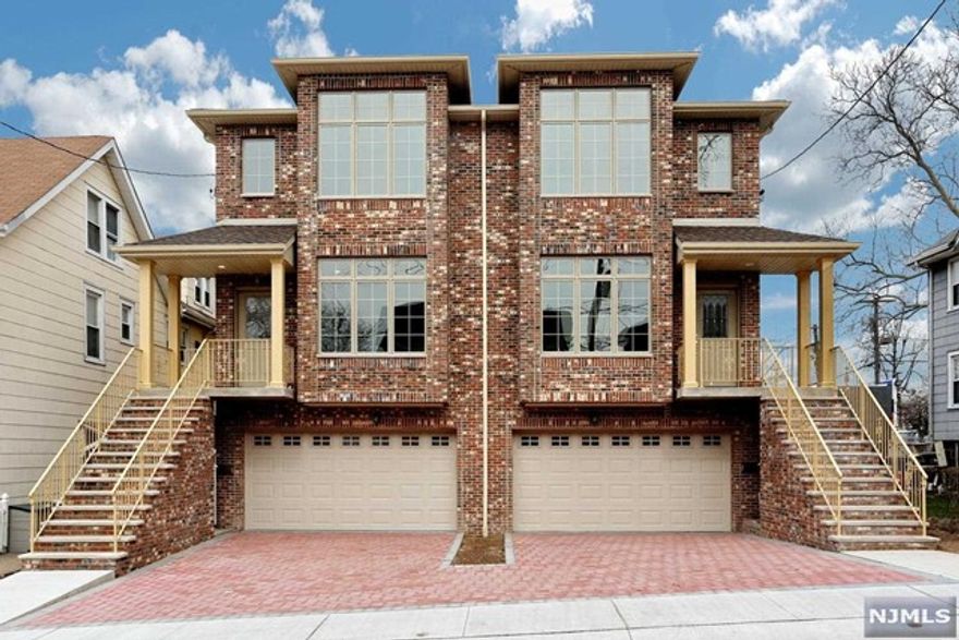 Built 2018 young 3 brs & 2 full/2 half bths brick duplex!Facing east/south all day bright!9ft ceiling & approx. 2800sq.ft larger size than regular duplex!Open & spacious layout in living rm & dining rm!All beautiful hardwood fls except tiled basement!Modern kit w/center island & custom cabinets & granite counter & ss appliances!Nice home office area & window seat access to deck!Master br w/3 big closets!Spa like mbth w/soaking tub & jet shower system!All brs are good size!Plenty closet spaces!2nd floor hallway w/skylight!Brick paver patio & fenced backyard w/trees!Walk out family rm w/hbth is perpect for extended family!2C garage plus 2C brick paver driveway parking spaces!Intensive recessed lights & molding throughout!All pella windows & 50 gallon energy efficient HW heater!4 Zone heating system & C/AC & CVAC!Close to ny trans & shopping!