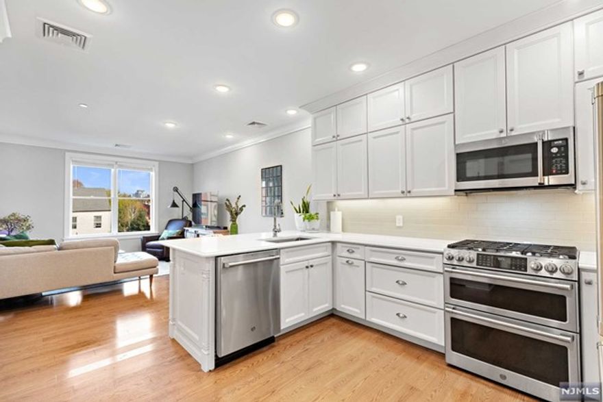 Amazing 2BR/2BA in the highly desirable, 28 Bright St 'The Liberty' building. The home boasts a spacious open floor plan, hardwood floors, tons of storage space, Pella windows, custom window treatments, high ceilings, Central A/C, intercom system, tankless hot water heater and in unit washer/dryer. The beautiful open chef's Kitchen features GE cafe series S/S appliances, custom cabinetry, quartz countertops, and a breakfast bar perfect for entertaining. The large master bedroom includes a spa like ensuite with radiant-heated floors. The elevator building offers its residents a lovely marble lobby, an exercise room with peloton equipment, outdoor shared courtyard, and bike/stroller storage room. Conveniently located in the heart of Downtown Jersey City by the Van Vorst Park, Grove St Path, Light Rail, Bus Stops, Restaurants, and much more! A commuters dream. Parking available for additional fee.