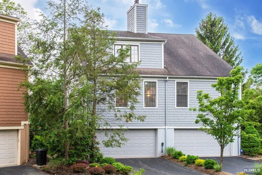 Very rare end-unit townhouse at High Mountain Village!! This 2-bedroom, 2.1 townhome has everything you have been searching for! First floor features a gorgeous high ceiling living room with fireplace, open concept dining room and kitchen, and a half bath! Upstairs you will find a spacious master bedroom with master bath w/ soaking tub and walk-in closet. Additional bedroom with en-suite bath w/ standing shower. Upstairs laundry area for easy access! Lower level features a family room ideal for a home office or playroom with sliders to the beautiful and tranquil deck, perfect for entertaining or drinking your morning coffee! A bonus basement for plenty of storage and over-sized 2 car garage. Also includes pristine hardwood flooring throughout, HVAC, pet-friendly, and low tax/HOA fees. Bring your finishing touches and make this your own. This will not last, call today!