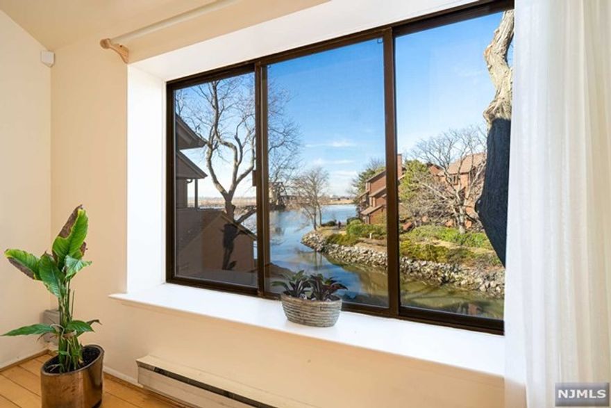 This absolutely charming, fully updated 2 bedroom/2.5 bath 1452sf townhome (Falmouth Model) with stunning water views is a must see!! Beautifully renovated, sleek and modern kitchen w/quartz countertops, stainless steel appliances and recessed lighting will bring out the chef in you! This gorgeous unit offers hardwood floors, elegantly updated bathrooms, high cathedral ceiling in living room and a fireplace. Enjoy a resort-like lifestyle with trails/board walk for relaxing, walking, running - amenities galore - pool with bar/cafe, tennis/basketball courts, marina, kids pool/play area, 24 hrs security, just to name a few! Commuters dream with NYC transportation at your doorstep!