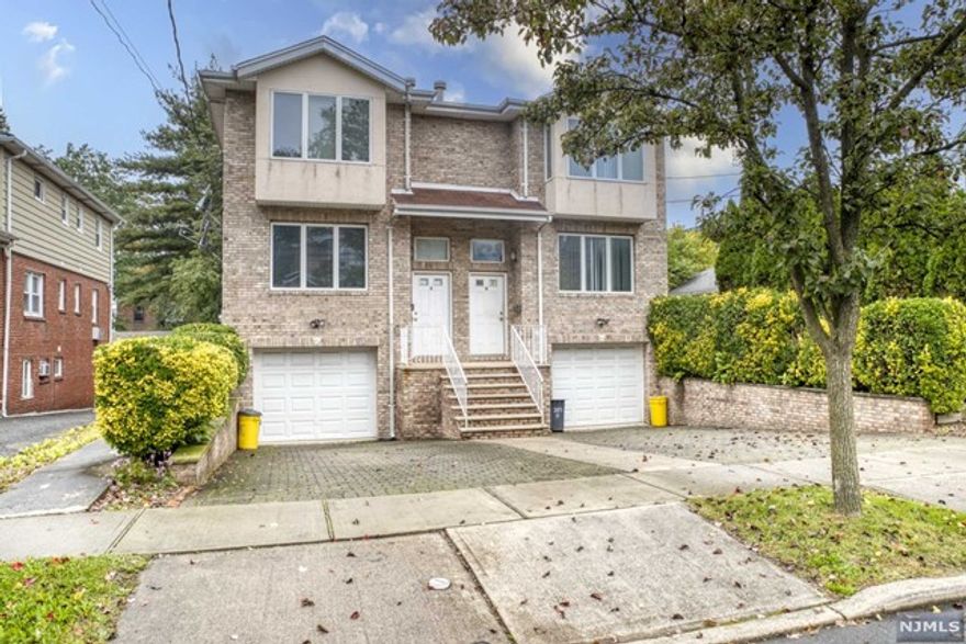 Welcome to this bright brick duplex, located in the heart of Palisades Park. This duplex offers beautiful hardwood floors, a spacious living room leading to the dining area, Modern eat-in kitchen with a sliding glass door to the deck. The second floor offers a Primary Bedroom en suite, 2 good size bedrooms and a full bathroom. Family room with full bathroom on the ground floor. Close to shopping and transportation. Convenient location to all. Come and make this your next HOME!!!