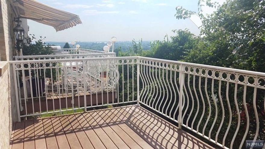 Lovely new like condition large duplex with fabulous scenic views! Situated in a very convenient location for NYC commuter with buses around the corner; Beautiful Hardwood floors throughout; the ample sized above ground floor has 12 feet cathedral ceiling and a full bath and exits to a large back yard.