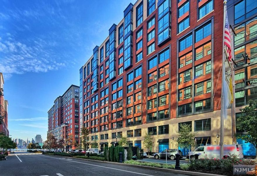 Welcome to this pristine-condition home at 1000 Maxwell Place, developed by Toll Brothers. You are greeted with gleaming 5" white oak flooring and oversized north-facing bay windows with views of the Empire State Building. The elegant kitchen space comes with custom walnut cabinetry, quartz countertops and stainless steel Thermador/Bosch appliances. Entertain your guest with your own private rooftop terrace at the top of 1000 Maxwell that comes with BBQ grills and furniture. The bedrooms are filled with abundant natural light and dual walnut vanity bathrooms. 1 deeded parking spot is included in the sale. Complex offers 24/7 concierge, a swimming pool with sun deck, 2 gyms, fitness center, residence lounge, workspace, children's playroom and shuttle to and from the PATH. Come take the opportunity to call this luxurious space your home!