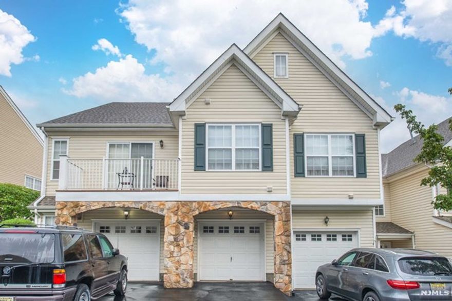 Welcome to The Highlands! Beautiful end unit, amazing private views & full walk out finished basement. Newer hardwood floors, LED lighting, with an open concept is perfect for entertaining. First floor includes formal living room with gas fireplace, nice size deck overlooking the valley, full dining room, kitchen with granite counter tops Laundry and garage entrance. Second Floor includes large Master Bedroom Suite with a walk-in closet & private bath with soaking tub & shower stall & a second bedroom. Unit has a large finished walk out basement with rec room, storage & full bath. Community pool & playground area. Minutes to shopping, restaurants, down town & major highways for commuting.