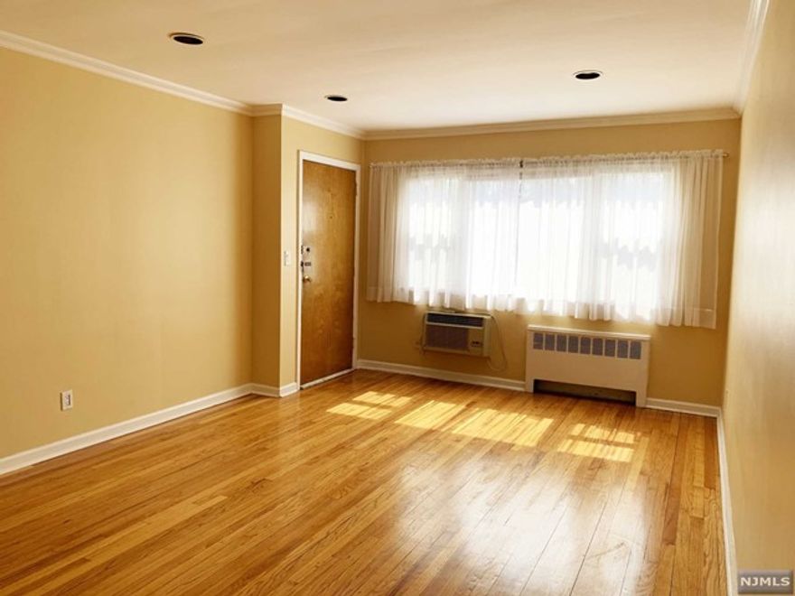 SPACIOUS APARTMENT WITH LOVELY BATH & COUNTRY EIK, LR WITH CROWN MOLDING, 1 KING SIZE BEDROOM, 1 QUEEN SIZE BR W/LG CLOSETS, HARD-WOOD FLOORS (80% of wood floors need to be covered) STORAGE, LAUNDRY & PARKING ON SITE. THIS BRIGHT, SOUTH FACING APARTMENT LOCATED ON A QUIET DEAD-END STREET IS A "COMMUTER'S DREAM". STEPS AWAY FROM MULTIPLE NYC/BUS/FERRY SERVICE, SHOPPING, LIBRARY & HIGH SCHOOL. HEAT & HOT WATER INCLUDED IN RENT. Sorry, NO PETS. Experian Connect Credit Check Required (approx $20) & Salary Verification. Rent Paid via Zelle. NEED 700+ CREDIT.