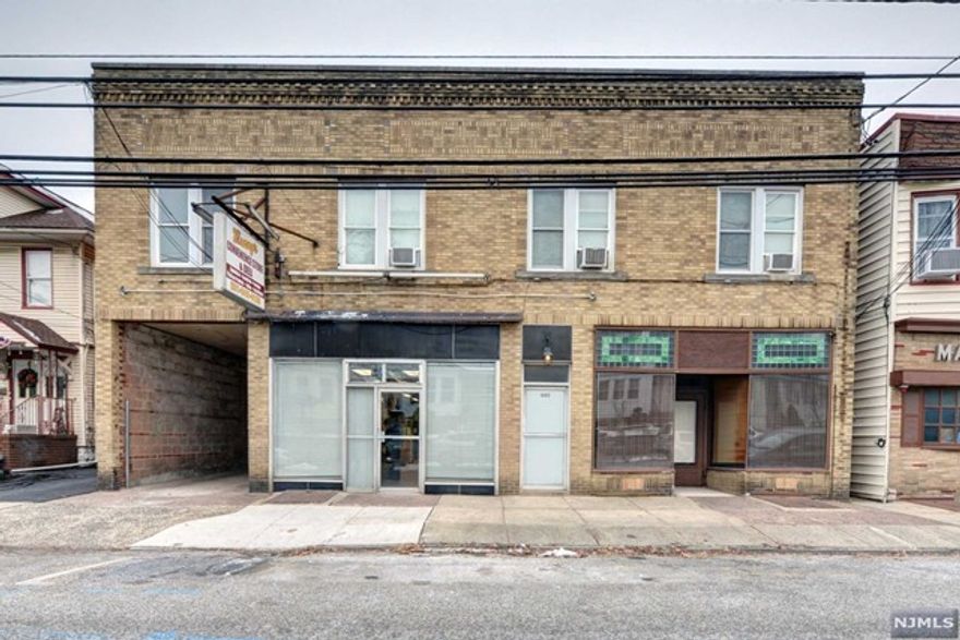 Unlock the potential of this remarkable 2-story solid brick and concrete block building strategically located for both convenience and investment returns. This property presents a lucrative opportunity for investors looking for a versatile and income-generating asset. The building features 3 one-bedroom apartments and two storefronts offer additional revenue streams, ideal for businesses or offices. Each unit is equipped with separate heat, gas, and electric utilities, ensuring efficiency and tenant satisfaction. Five concrete block garages with steel overhead doors provide secure parking and storage options. Conveniently located for commuting to NYC, Manhattan, and Jersey City. Proximity to public transportation adds to the property's appeal. Capitalize on the property's fame by listing it as a potential film location. Previously featured in productions such as "Jersey Boys," "Trial of the Chicago Seven," and "The Plot Against America"
