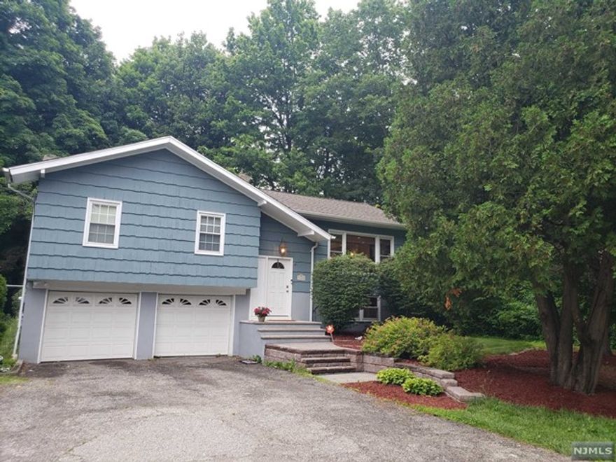 Great bilevel close to Greenwood Lake as well as the center of town. the home features a large LR, Kitchen, DR with sliders to a double deck and large private backyard. Primary bedroom includes a half bath. 2 additional bedrooms and main at completes the main living area. Sit back and relax in the family room on the lower level, which also features a laundry room, utility room and entrance to the 2-car built in garage.