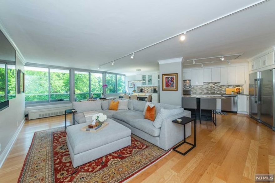 This stunning sunlit 3 bed, 2.1 bath condo boasts an impressively modern interior w/ exquisite finishes & ample space for comfortable living. The renovated chef-grade kitchen includes top-of-the-line appliances: stainless Sub-Zero wine fridge, Viking stove & Frigidaire Pro Series refrigerator/freezer, as well as a convenient coffee bar for your morning brew. New wood floors thru-out, elegantly updated bathrooms (primary bath w/ radiant heat!), ample in-unit storage, new heat/ac units & relaxing terrace ideal for entertaining. 3 spacious bedrooms, including double walk-in closet in the en-suite primary. Maintenance fees include all utilities/amenities - heated pool, tennis courts, exercise room & 24/7 doorperson, ensuring comfort & security. Easy NYC commuter location: close to GSP, Rts 3/46/280, shops, eateries, schools, parks, as well as all the vibrancy of nearby Montclair. Your new luxurious & convenient lifestyle awaits!