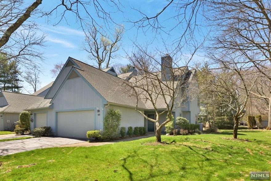 Beautifully maintained end-unit in small Desirable Private community! Excellent location w/2 CAR GARAGE! Large Entry Hall w/closet. Beautiful Gleaming newer wood floors in spacious open-concept Living Room & Formal Dining Room. Living room has raised area w/ gorgeous fireplace & custom mantle. Glass doors open to private patio & private grassy area with privacy trees behind. Modern Kitchen w/ wood cabinets, great condition with tile floors. Opens to separate casual eating area that could easily be used as an office, just off the main entry. Office/den or 3rd Bedroom is also located on main level off the Living Room, as well as Laundry, Garage Access & a guest Powder Room. Upstairs are 2 spacious bright Bedrooms. Primary has glass doors to a private balcony & tons of closet space as well as en-suite Bath w/double vanity, tub & walk-in shower. 2nd Bedroom has a hall Bath W/standing shower. Sought After Community! Close to Everything including NY bus stop, shops & Highways & MORE!