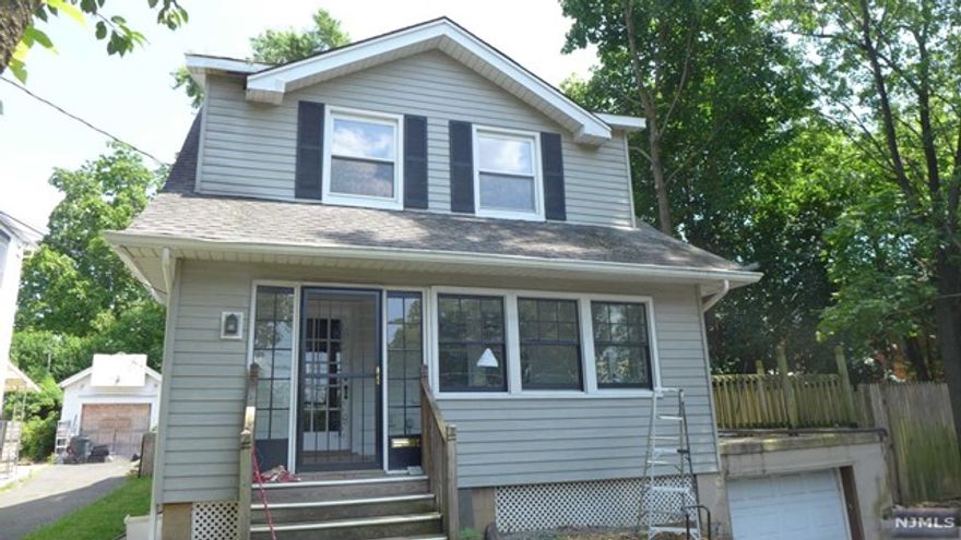 Discover this updated, charming colonial in a highly convenient area. Featuring a newer, modern kitchen, bathroom, and powder room, as well as hardwood floors throughout. Enjoy the new enclosed front porch, front entrance way steps, and driveway. The entire house has been freshly painted. Entertain on the large deck above the garage. Stay cool with two central air-conditioning systems. Plus, a spacious backyard and easy access to schools, library, stores, and NYC bus stops.3 bedrooms,1.5 bathrooms.