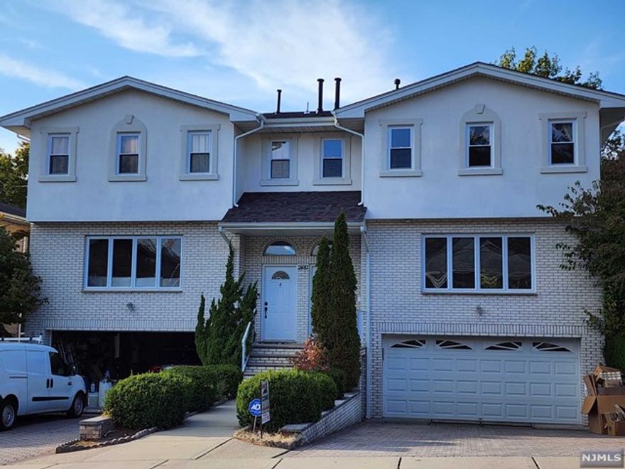 Oversize Duplex in highly sought after neighborhood on the northside of Fort Lee on the border of Englewood Cliffs totally renovated in 2020. Large Primary Bedroom with en-suite spa-like bathroom, 2 additional bedrooms with full baths to share. Sun drenched living room, spectacular modern eat-in-kitchen, large deck off the dining room, 1 half-bath. Fully finished basement with a separate entrance to outside, perfect for a family room or guest bathroom suite with full bathroom. Hardwood floors throughout, skylights. Two-car attached garage. Incredibly spacious backyard. Close to public transportation. Walking distance to Blue-ribbon School #3.