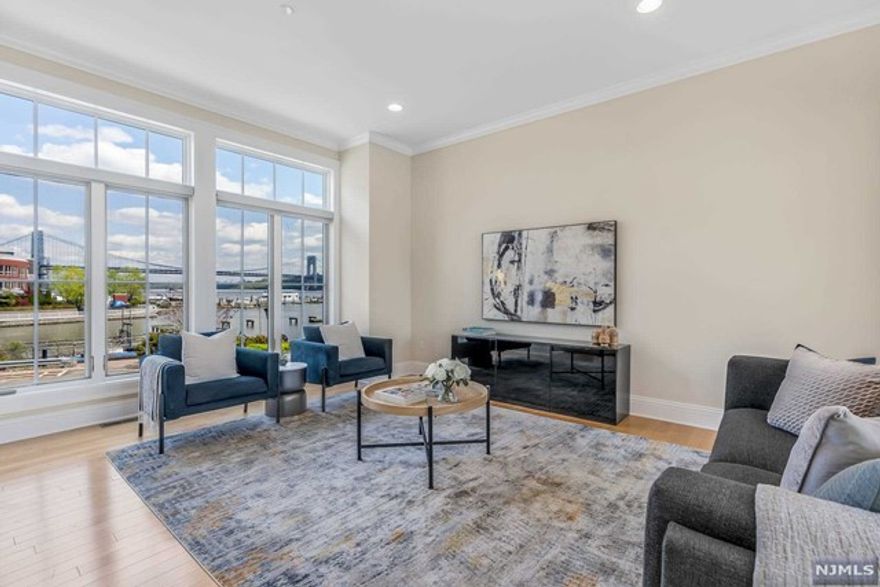 Discover pure luxury at one of the most coveted unit tucked away at the pristine private gated community on the Hudson River 'The Moorings'. This remarkable 4 bedroom, 3.5 bath townhouse (aprox 4,329 sqft.) on three levels connected by a private elevator, features unparalleled views of Hudson River, New York and GW Bridge. Enjoy the indoor-outdoor living with its huge interconnected terrace and patio. Gourmet eat-in kitchen complete with center island, granite countertops, and top of the line appliances and custom cabinetry. Large open floor, formal dining room and sitting room, spacious family room with fireplace. Luxurious primary suite with vaulted ceiling, balcony with majestic NYC & water views. Spa-like bathroom featuring whirlpool and stand up shower, separate water closet. Large walk-in closet. 10ft ceiling, custom mill work, hardwood floors. Two car garage. 24hr security and easy access to NYC.