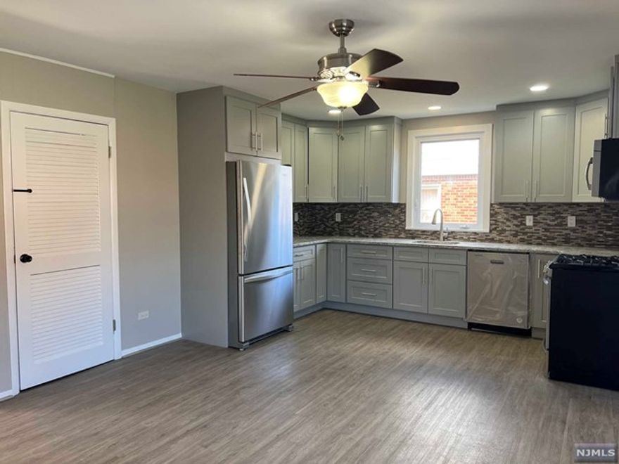 Feel right at home at this sunny & bright, completely renovated and move-in ready 2 Bed/1 bath first floor apartment with its own private deck and shared use of the yard. Beautiful spacious new kitchen with quartz countertops and a large pantry. Your own laundry/mudroom with a sink right off the deck. Hardwood floors throughout. Brand new wall AC units. 2 driveway parking spaces. Electrical included. NO SMOKING and NO PETS. Prospective tenants to provide NTN report. Min Income requirement 2.5 times monthly rent. Credit check, income verification, Interview with the landlord. 1.5 months security deposit and 1 month Real Estate fee due at signing.