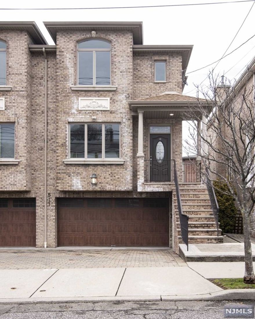 STEP INTO THIS SUNNY SPACIOUS ALL BRICK BEAUTIFUL DUPLEX WITH OVERSIZED GARAGE. GROUND LEVEL FAMILY RM, FULL BATH AND SEP ENTRANCE. FIRST FLOOR FEATURES HARDWOOD THROUGHOUT, NEW CHEFS KITCHEN WITH ISLAND AND SLIDERS TO WALK OUT TO DECK. LIVING ROOM,FORMAL DINING ROOM WITH CROWN MOLDING THROUGHOUT. 2ND FLOOR FEATURES HARDWOOD THROUGHOUT,LAUNDRY, MBR,MFB W/DUAL SINK VANITY, SHOWER AND LARGE SOAKING TUB, LARGE 2 BR'S FULL BATH/SOT. 3 ZONE HEATING SYSTEM, CENTRAL AC. WALKING DISTANCE TO NY BUS, SHOPS AND RESTAURANT. DON'T MISS THIS EXCEPTIONAL RENTAL PROPERTY! LANDLORD WILL CONSIDER PET.