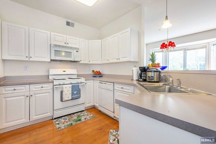 Beautiful sun-filled multi-level townhome in Cambridge Crossings! The main level of this property features a modern open floor plan with a white kitchen, breakfast bar, hardwood floors, recessed lighting, gas fireplace and large bay window with a window seat. Upstairs are two bedroom suites both with vaulted ceilings. The master suite has two closets and an oversized full bathroom which includes a large soaking tub and double sink vanity. This gated, amenity rich community offers a clubhouse, outdoor pool, 24-hour saunas and exercise room. The Clifton Train Station and NYC buses are less than one mile away. Enjoy!