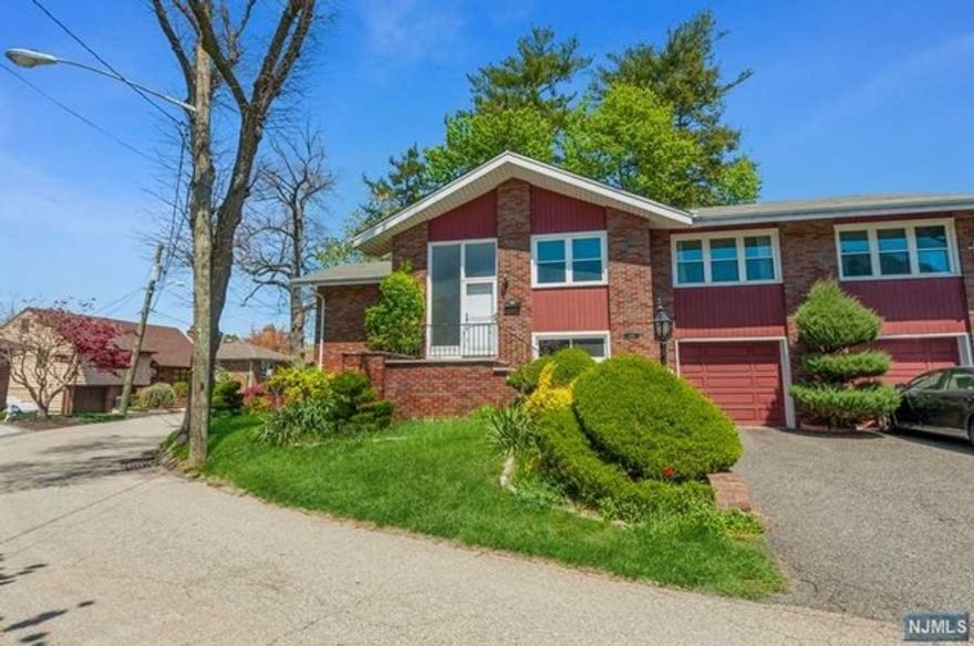 Dont miss the opporutnity to see this lovely brick B/L style home located on a private street This home is over 3000 sq ft with large rooms, great for extended family. This well maintained home features hardwood floors, sunlit living room with fireplace, formal dinning room, four bedrooms and three full baths. Ground floor is great for working from home or extended family. Close to NYC transportation and shopping. Come see what this well mainteaned home has to offer! This is a great renta! Tenant responsible for all utilities and lawn maintenance.