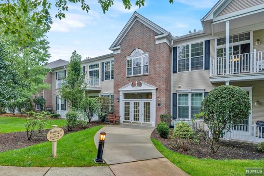 Live a maintenance free lifestyle in the upscale Four Seasons at Wayne, 55+ Active Adult Community! This elegant Cherry Model, END UNIT, is bright with a spacious open floor plan with vaulted ceilings. The eat-in-kitchen has an abundance of cabinetry with NEW range and microwave, newer dishwasher and fridge, and sliding doors to your private patio for a cup of coffee before heading over to the pool, tennis, or clubhouse. Large master bedroom w/ walk in closet, additional closet, and en suite bath w/double sink vanity. Utility room with newer hot water heater and furnace, and a full washer and dryer. Convenient indoor garage with elevator, 2 assigned parking spots, and storage unit. Convenient to shopping, restaurants, and major transportation. All appliances included in sale.