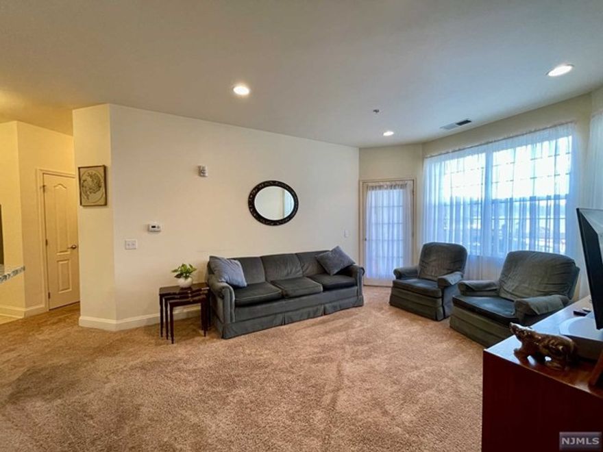 LIVE THE GRANDE LIFE! Very rare, 1st floor Kerria Model with 1149 sf of elegant living space. This beautiful unit boasts two generously sized bedrooms with WIC in each bedroom. The primary bedroom suite features its own bathroom & sliders to the patio & courtyard. The beautiful kitchen features SS appliances, center island w/breakfast bar, granite counters & pantry. Open concept formal dining & living rm with doorway to another patio with courtyard access. Additionally, this unit features a versatile space for an office /tech area with a convenient storage closet. Full size washer /dryer in unit. Come live the Grande life in this beautiful one flr living condo on the first flr of Bldg 4 - newest building. Courtyard has bbq grills, benches, gardens, pergola & wonderful views of the mountains. Life couldn't be sweeter in this lovely condo! Enjoy the Grande life with 2 clubhouses, 2 tennis courts, fitness ctrs, billiards rms, & much more! Low taxes $6257.