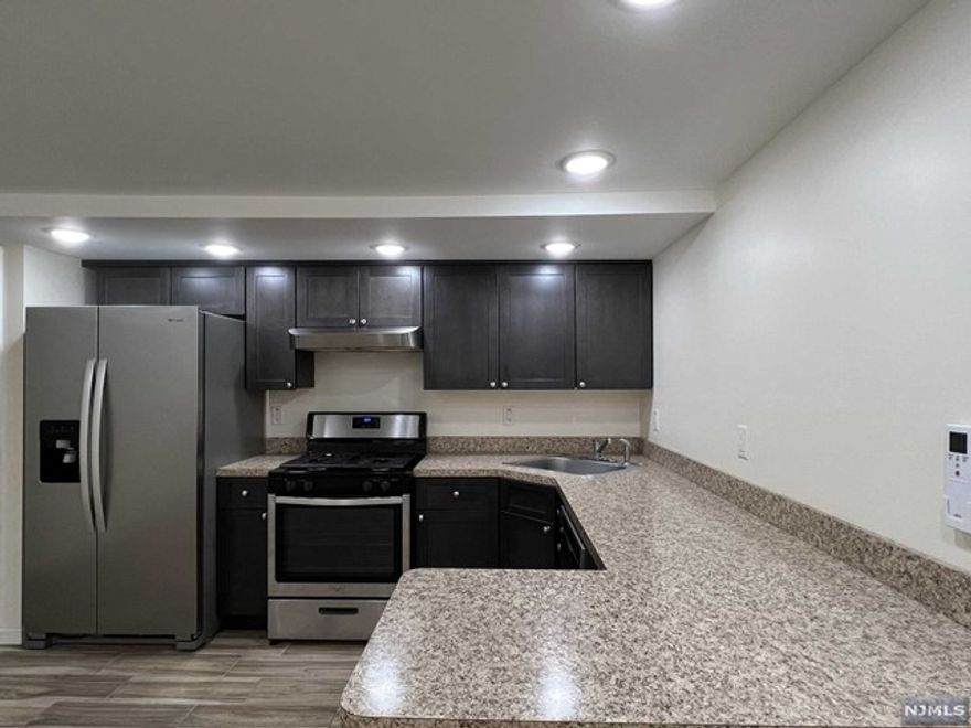 This delightful 1 bedroom and 1 bathroom apartment situated at 40 College St boasts an enviable location with easy access to various transportation options. Step inside and you'll be greeted with stylish renovated floors, a contemporary bathroom, and a spacious layout, giving you the freedom to let your imagination run wild. The kitchen is equipped with sleek stainless steel appliances, an on-demand Navien hot water system, and even includes washer/dryer hookups. And that's not all - take advantage of the added luxuries of a private backyard and your very own parking spot. Don't miss out on the opportunity to live on this peaceful street - book an appointment today before it's too late!