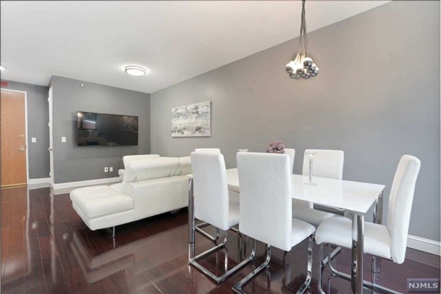 The feel of a private villa at a prestigious multi-million dollar luxury building in a great location next to major shopping locations and transportation. Facing south west, this bright and sunny unit has a private entrance in addition to main access. This original and renovated 1 bedroom was turned into a 2 bedroom. Very large patio. Amenities: gym, 24-hour doorman, outdoor pool, library, community room, in-unit washer/dryer, 1 parking spot deeded (additional parking available for cars $175, motorcycles $75), visitor valet parking, close to shopping and main transportation (ferry and NJT to NYC).