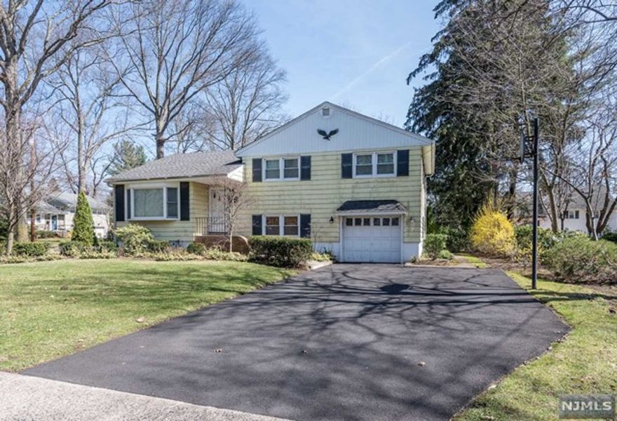 Lovingly maintained three bedroom home in a convenient Ridgewood location. Open living room, dining room, updated kitchen with granite/stainless steel appliances, three season porch with access to the private yard and patio. Upstairs are two bedrooms and the master with en suite full bath. The lower level which contains a family room, powder room and mud room/laundry with exterior access is great for entertaining. Basement can be used as storage space. Amenities include newly paved driveway, new hot water heater, newer air conditioning compressor, newer master bathroom, newer microwave/refrigerator, hardwood throughout, sprinkler system, attached garage. Minutes away from schools, Ho-Ho-Kus train station and the Ridgewood Park and Ride. Landlord provides lawn care. Tenant is responsible for snow removal, utilities and first $150 of repairs. Interview, credit check and proof of renter's insurance is required. This is a non-smoking, pet-free home. Welcome to Ridgewood!