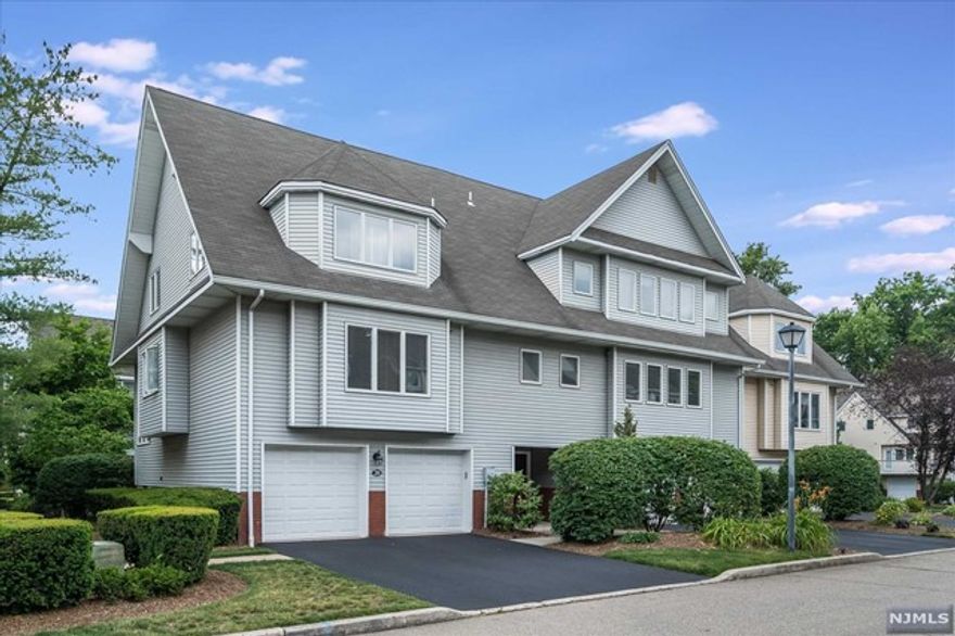 Spacious multi-level end unit townhome in Glen Rock's Iris Park,offering 3 BRs & 3 baths.This light & bright home boasts great rm w/soaring vaulted ceilings,wall of windows,corner wood burning fpl & outside entry to a private deck w/gas line for grilling this summer!Overlooking this fabulous room is the large & inviting kitchen w/dining area & walk in pantry.The home offers a versatile floorplan w/a BR w/WIC adjacent to the kitchen,currently being used as a home office/den.A full bth completes this level.Upstairs you'll find 2 oversized BR suites-both w/private baths & WICs.Laundry & linen closet are conveniently located next to the BRs.Finished lower level fills so many needs w/a rec room & addl storage.HW floors,updated central air,2 car oversized garage w/new doors & inside entry.Lovely community rm for private parties is included in the maintenance.Iris Park is set on a quiet street,yet close to transportation,schools,charming downtown dining & shopping & wonderful town pool!
