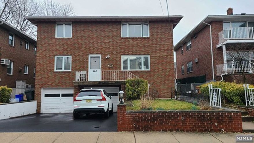 Very spacious and Well maintained 2 family house 1st fl. Living room, dining room, 2 bedrooms and 1 full bath. . All Hardwood. Separated W/D on side.one car garage and outside parking included in rent . a brick paved back yard. Dead-end street in the best sections of Fort Lee. blocks away from the GWB or bus to NYC.