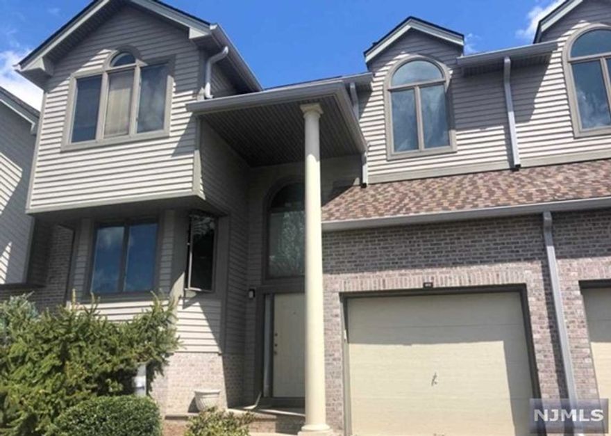 Welcome to Northwoods community!! This well maintained 4 bedroom and 3.5 bath townhouse unit offers open layout with Beautiful hardwood floors, Cathedral ceilings & wall of windows in spacious living room and dining room. Plenty of storage and oversized deck. Renovated basement with hardwood floors bedroom and full bath. Excellent school system, Playground,Pool, Gym, Tennis. Home is located on a quiet street and receives plenty of natural light throughout the day. Northwoods amenities are included club House, exercise room, playground, tennis court and pool. Location offers close proximity to schools, shopping, NYC transportation and golf course.