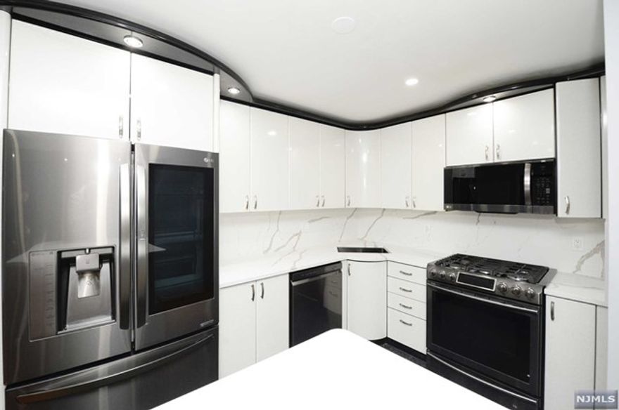 Indulge in the epitome of townhouse living in the prestigious Saddle River Park Estates! This immaculate townhome offers over 1700 sqft of living space, not including the basement and walk-up attic. Upon entry, bask in the sunlight of the foyer leading to a convenient 1/2 bathroom, an updated modern eat-in kitchen, a welcoming living room, and a dining area that opens to the patio a seamless blend of elegance and comfort. The second floor unfolds with a skylight ,2 generously sized bedrooms, a well-appointed hallway bathroom, laundry, and a primary bedroom suite featuring an ensuite bathroom complete with a jacuzzi tub and stall shower. The second floor also grants access to the walk-up attic, providing ample storage space for all your needs. The finished basement is a retreat of its own, boasting a full bathroom and a sauna an ideal space for a home gym or relaxation haven. Enjoy the perfect combination of luxury, convenience, and comfort in Saddle River Park Estate!