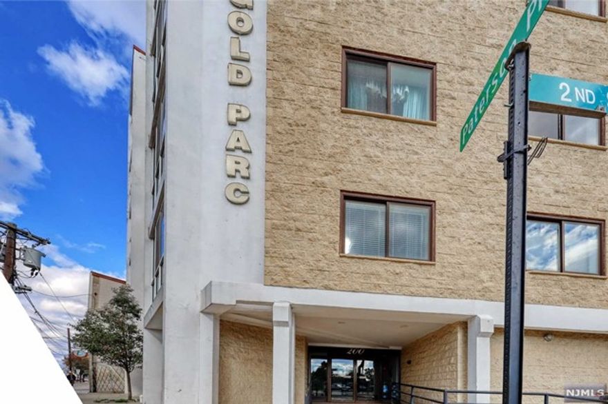 Here is an opportunity to live in a pent-house condo in wonderful Union City! This 3 bedroom, 2 and one half bath unit is only 1 of 2 located on the top floor of the Golden Parc Building. There are 2 floors to this condo. On entering the foyer you will see a large living room/dining room area plus a powder room and a nice size kitchen. A large potion of the floor is marble. The second floor contains three bedrooms, one of which is the master suite. Additionally, there is an inside parking space in the garage to protect your car from the elements. A public park is just across the street which is perfect for year round enjoyment. Almost any kind of shop, restaurant, etc. is just minutes away. Public transportation into New York and other points is just outside the building entrance. With some work and imagination, this gem will really sparkle. Make a date to see it today!