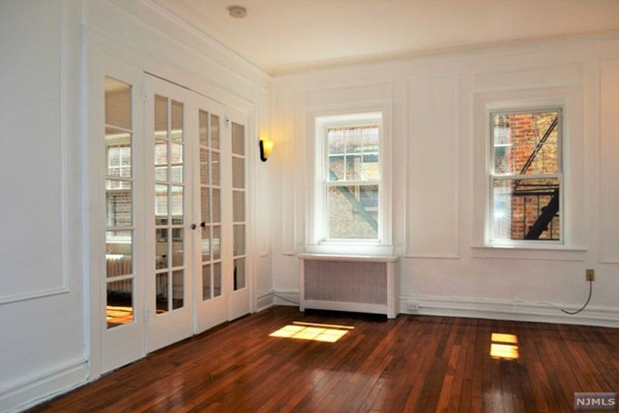 Ideally located true 2 BR 1 BA condo in an elevator building steps from Blvd East, Braddock Park and all the great restaurants and shops on Broadway. The Historic charm of this home includes original hardwood flooring throughout with timeless crown molding, an updated kitchen and stainless-steel appliances. A large living room and bedrooms, amble storage space, provide that rare mix of prime location and space. Street parking is available with a free parking permit from the town of North Bergen. Laundry room in the basement make this home a commuter's dream. Rent includes water, heat and hot water.