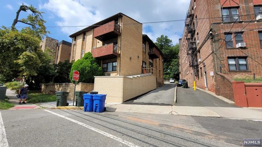 Newly renovated 1 BR apt w/ cathedral ceiling, balcony, located within walking distance to NJ Transit train & bus stop. Galley Kitchen w/ granite tops, tile floor, new SS appliances, microwave & dishwasher. Newly updated full bath. Bedroom with plenty of closet space. Rent includes heat & hot water, tenant pays electric. Assigned storage closet & coin-operated laundry in basement. Reserved parking space for 1 car in rear of building $50/month. Application, credit check/background check required, fee paid by tenant. No pets. Great for commuters! Must see!