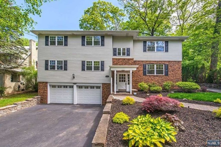 This updated home offers a blend of comfort and convenience in the highly sought after town of Ridgewood. On the first level you'll find a spacious living and dining area, perfect for relaxing and entertaining. The large updated kitchen is equipped with plenty of counter space and stainless steel appliances. The primary bedroom boasts dual closets and a full bath for privacy and comfort. Two additional bedrooms and another full bath on this level ensure ample space for family or guests. The lower level expands your living options with high ceilings, family room, an office area ideal for remote work or study, and another full bathroom for added convenience. Located close to town, this home offers easy access to shopping, dining, schools, and transportation. **Pictures are from second floor unit, but finishes are identical to the first floor unit.