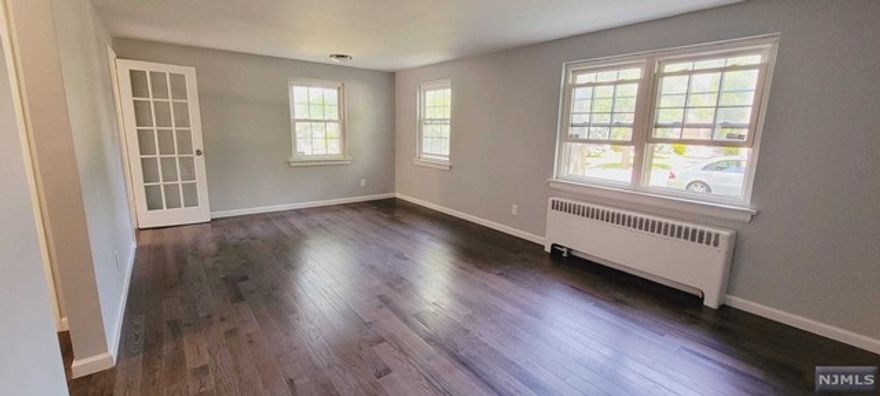 Beautiful, fully renovated walk in first floor apartment. Brand new Kitchen, bathroom and floors throughout the apartment. Large bedroom with his & hers closet.