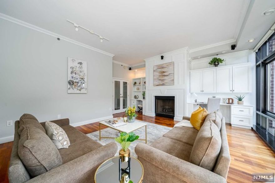 Rare 3800+ SF luxury duplex w/ engaging floor plan & striking interiors. 1 year of parking included. 1st floor features open living space w/ 10 ft ceilings & glass stairwell. Kitchen offers SS appliances, dish washer & center island w/ beverage fridge. Dining area has granite kitchenette, wine fridge, large pantry & balcony. Leisure area w/ fireplace, custom built-ins & immense natural light. Suite w/ large cedar WI closets & balcony. Ensuite bath with spacious shower, vanity, heated floors & more. 2nd floor features additional 4 beds, den, 2 baths, 2 balconies, washer/dryer room & kitchenette. 2nd suite has decorative ceiling, fireplace & balcony. Also custom dressing room & huge ensuite bath with jacuzzi, shower, double sinks & heated floors. Other amenities: HW floors, recessed lighting, floor to ceiling windows, Hunter Douglas shades, & storage. Sky Club offers 24 hour concierge, PATH shuttle, comm room & bike storage. Near light rail, restaurants, shops, parks, & schools.