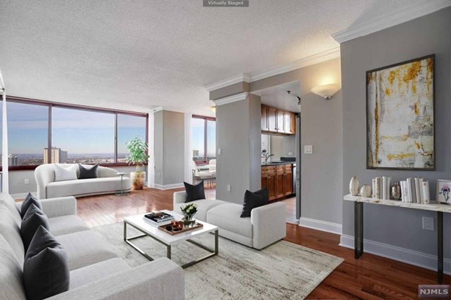 he Palisades... Luxury condominium in Fort Lee. The '02'line. Corner two bedroom and two and a half baths. Just renovated.Brand new hardwood floors, stainless steel appliances and freshly painted.High floor with spectacular views. Sparkling north east and west. NYC and GWB views.Two indoor parking spaces. Pet friendly. Enjoy the amenities. Fitness center, community room, conference room, library, children's playroom, cafe, outdoor pool and barbeque. Highly rated schools. Close to all New York transportation, restaurants, stores and Houses of Worship.