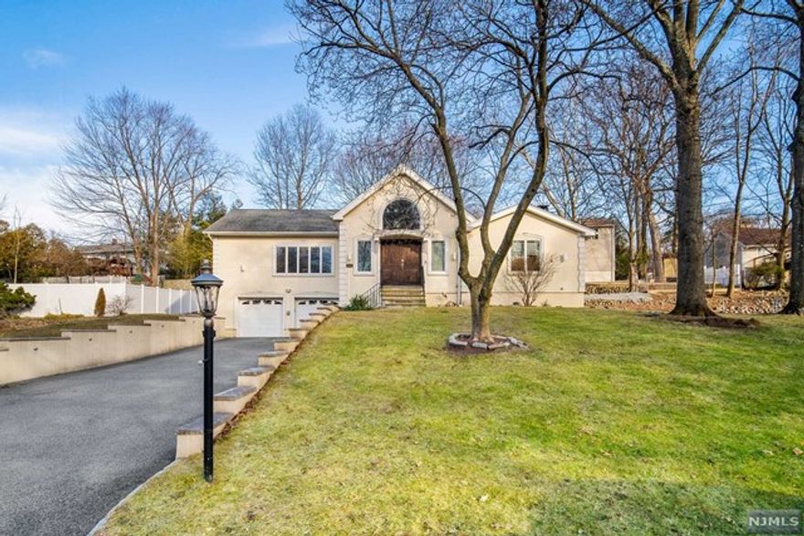 Spacious and wonderfully renovated raised ranch on an oversized lot in the Township of Washington. Walk right in and say wow to super high ceilings and an open concept floor plan. Massive primary suite with walk in closets and ensuite bathroom. 3 more bedrooms round out the first floor with additional full bathroom. Approximately 1900 sq ft on the first floor and 1000 sq ft more on the ground level which includes an office and a full bathroom. Two car attached garage with a nice, wide driveway. This is a must see!