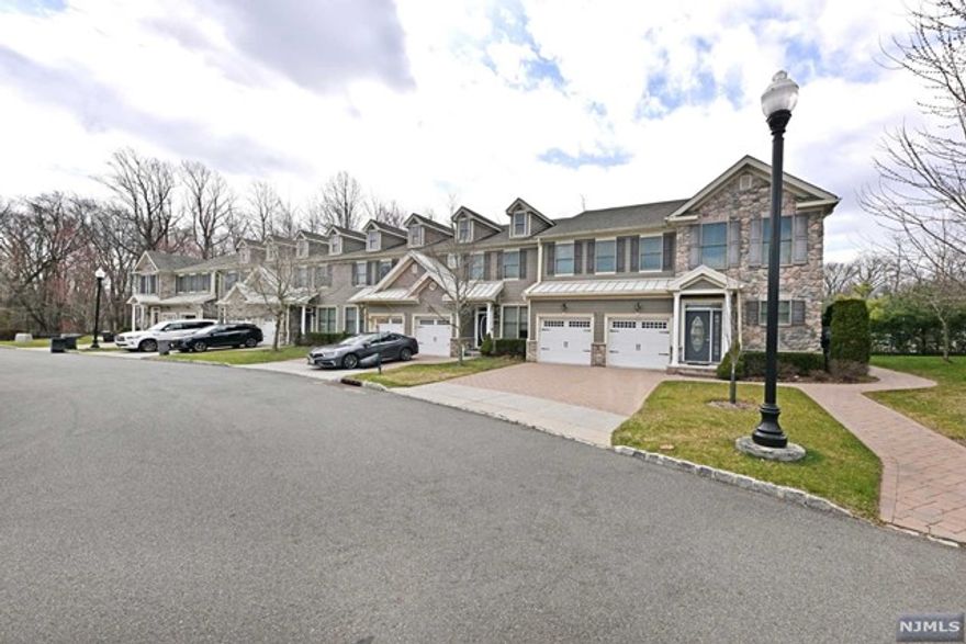 Don't miss this sought-after Cypress Model 2 bedroom,2 bathroom end unit located in the desirable Whitney gated community. This home boasts numerous upgrades & features that are sure to impress. Easy one floor living in this beautiful open concept layout w/hardwood floors & nine foot ceilings. The modern white kitchen boasts black granite countertops & stainless steel appliances. The living room features a cozy gas fireplace w/elegant marble surround and automated shades. The large primary bedroom includes a walk-in closet & primary bath w/walk in shower. The spacious finished basement is perfect for a recreation area/home office. There is an attached garage for secure parking. And a central vac for easy maintenance. The private patio area is ideal for outdoor relaxation. All just steps from the pool, playground and clubhouse. The Whitney is conveniently located in the desirable town of Allendale which boasts highly rated schools and convenient proximity to NYC transportation.