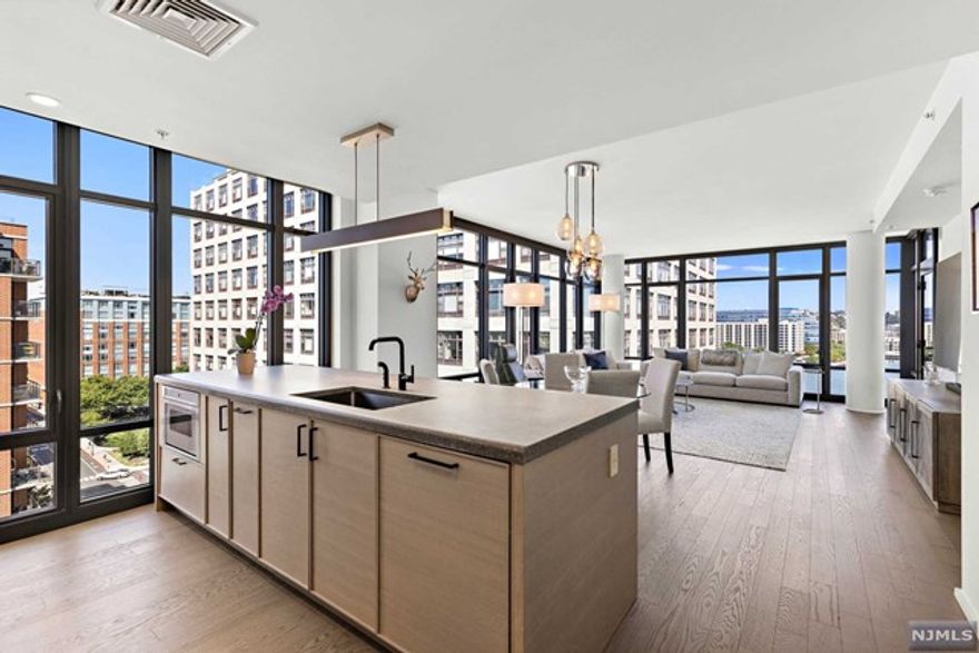 Welcome to 1425 Hudson Street, Unit 10E, where luxury living meets urban convenience. This spacious 1421 sq ft 2-bedroom, 2.5-bathroom residence is a testament to meticulous craftsmanship and stunning design.Upon entering, oversized windows bathe the space in natural light, creating an atmosphere that's both inviting and energizing. These windows also frame captivating panoramic views of the surrounding cityscape and NYC Skyline. The open-concept layout seamlessly combines modern aesthetics with functionality, providing a versatile space for both entertaining and daily living. Additionally, the gourmet kitchen features top-of-the-line appliances, ample counter space, and stylish cabinetry.Situated in Hoboken's vibrant waterfront north community, this residence offers easy access to NYC via multiple transit options,making your daily commute a breeze.Don't miss this chance to experience the pinnacle of Hoboken luxury living.