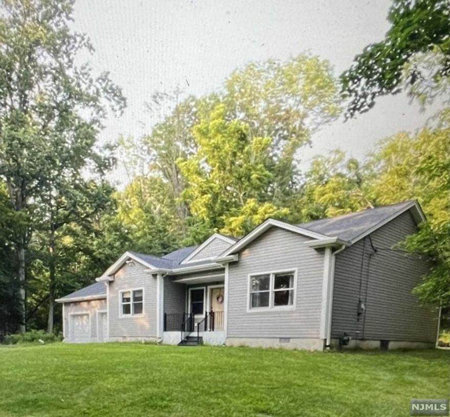 Young home built in 2016 offers 3 nicely sized bedrooms & 2 beautiful full baths. Master bath with stall shower. Eat in kitchen, living room. Gleaming hardwood floors throughout much of the home. Laundry, washer/dryer included. This home is bright and open. Oversized 2 car garage with openers. Park like property with patio offers privacy. This is a move in ready home. Well built makes it energy efficient. Sewer and natural gas. Central air and baseboard heat/multi zone. Attic with pull down stairs provides extra storage. Terrific location close to transit, restaurants and other amenities. Wayne offers many programs for adults and children - top rated school district in Passaic County.