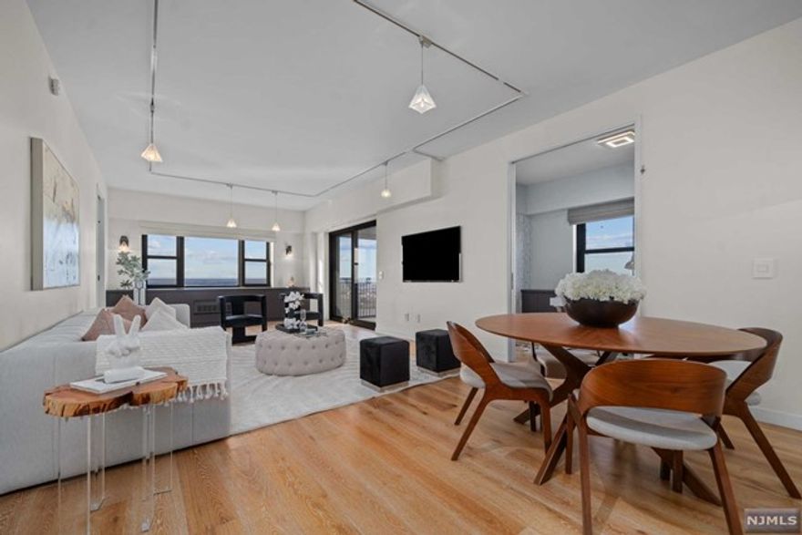 ***WAYNE BONSELL (607-239-0541) & TOM MCCARTHY*** Present; Welcome to the pinnacle of upscale living at Parker Imperials PENTHOUSE 30A! The entire unit has undergone renovations using hand selected materials that are sure to impress. This vibrant 2-bedroom + office top floor unit, features lofty 9ft ceilings, stunning wide plank wood flooring throughout, custom built-ins, porcelain tiled bathrooms, custom lighting & switches & private terrace. Building amenities include 24 hour doorman, 24 hour garage attendant, on-site management, 24 hour super, on-site fitness center with saunas, outdoor heated pool with sun deck. Transportation to NYC at door.Don't miss out on the chance to experience luxurious high-rise living at its finest! Call/text WAYNE BONSELL @ 607-239-0541 for a private showing.