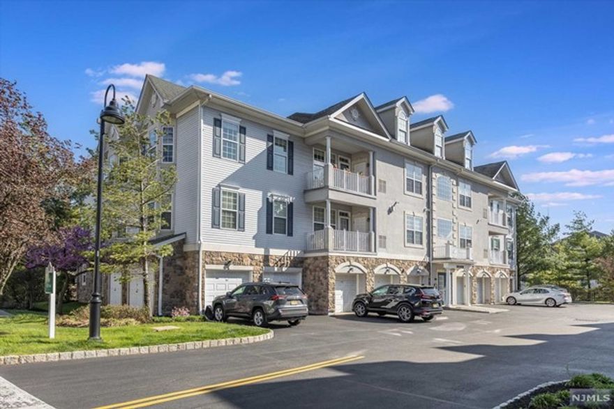 Move right into this bright & airy top floor Begonia unit at the resort-like Four Seasons at Great Notch, a 55+ active community just 12 miles from NYC & next door to vibrant Montclair w/tons of eateries, culture & shopping! This home features high ceilings, HW floors throughout & an open floor plan, perfect for entertaining. There are custom built-ins & a gas fireplace in the living room & stainless appliances & granite countertops in the spacious kit. The primary bedroom feats a huge walk-in closet & generous ensuite bath. Sip coffee on your private outdoor patio each morning! In-unit laundry & attached garage w/storage are added bonuses. Plenty of activities at the state-of-the-art clubhouse incl a glass-enclosed indoor pool, outdoor pool, putting green, fitness center, library, card rooms, bocci & tennis courts & walking paths, (to name a few). The many activities & clubs can keep you as busy as you'd like or just relax on a community bench overlooking gardens & NYC views!