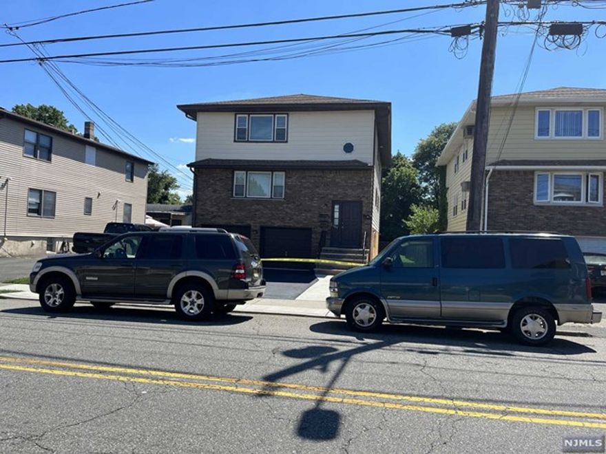 LOCATION, LOCATION, LOCATION!! Spacious 2nd floor apartment with 3 bedrooms/2 full baths/HUGE kitchen/LR/DR. Driveway parking for 2 cars/shared use of ample back yard with 1st floor tenant/laundry hook-ups provided/NY bus stops seconds away!!
