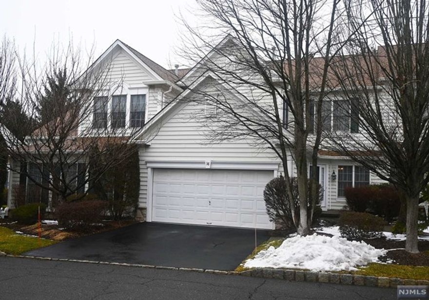 Welcome to this extraordinary Townhome at the Brettonwoods in Paramus. This immaculate 3 bed, 3 1/2 bath with large finished basement awaits your arrival. When you arrive through the front door you are met with beutiful glaring hardwood floors and 10' ceilings that travel through out the home. Behind the french door sits a stunning library. A large eat-in kitchen with beautiful granite counter tops with sliders to the private deck. A family room with gas fireplace which will keep you warm. A half cut out wall gives you the open concept to the large dining room and living room. The second floor has 3 large bedrooms and 2 full baths. The master bedroom has a whirpool bath tub and seperate shower and large walk in closet with organizer. The basement possesses high ceilings, large family room with a full bath and large office and lots of clean storage space. This is a must see, move in condition Townhome. Impressive! Enjoy the convenience NJ/NYC trans., shopping,schools & dining.