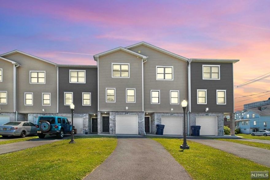 This newly constructed 2,250SF 5 Room townhouse has three floors of flexible living space. Ground floor has entrance from private garage, half bath, and den/playroom with sliding glass doors to private patio. Main floor offers sleek modern kitchen open to large living/dining area plus separate formal living room or potential bedroom/office and additional half bath. Top floor laundry room, bedroom, hallway bath, as well as master bedroom and master bath. Interior includes porcelain tiles in both the kitchen and living room with hardwood floors throughout the rest of the house. Also includes finished pine stairs with railings, LG washer and dryer, central vacuum, satin nickel bathroom fixtures, and brand new stainless steel appliances. The townhouse has high efficiency forced air, gas heating system & central air conditioning systems as well as burglar alarm system. Close to NYC- Lincoln Tunnel and George Washington Bridge. Transportation nearby. Sorry, no pets.